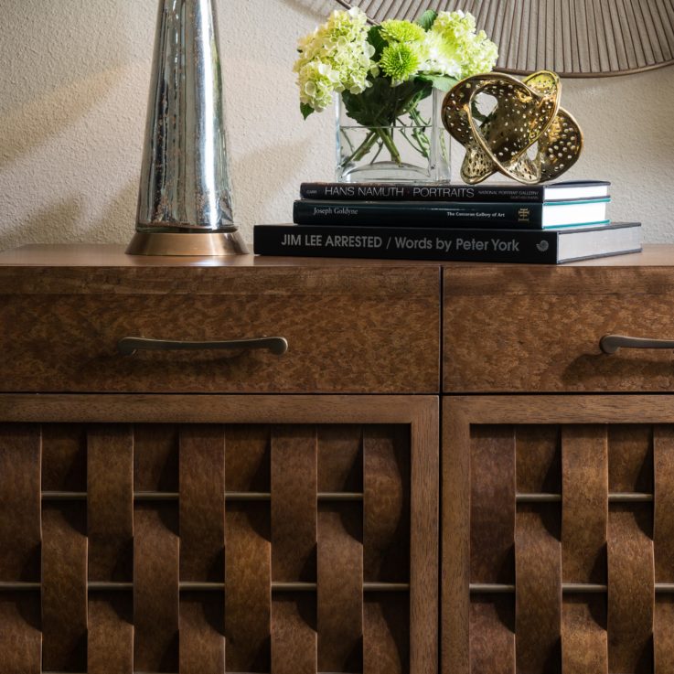 Wooden dresser with three books on top