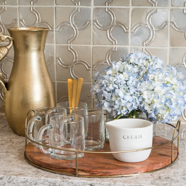 Wooden and brass tray with coffee glasses