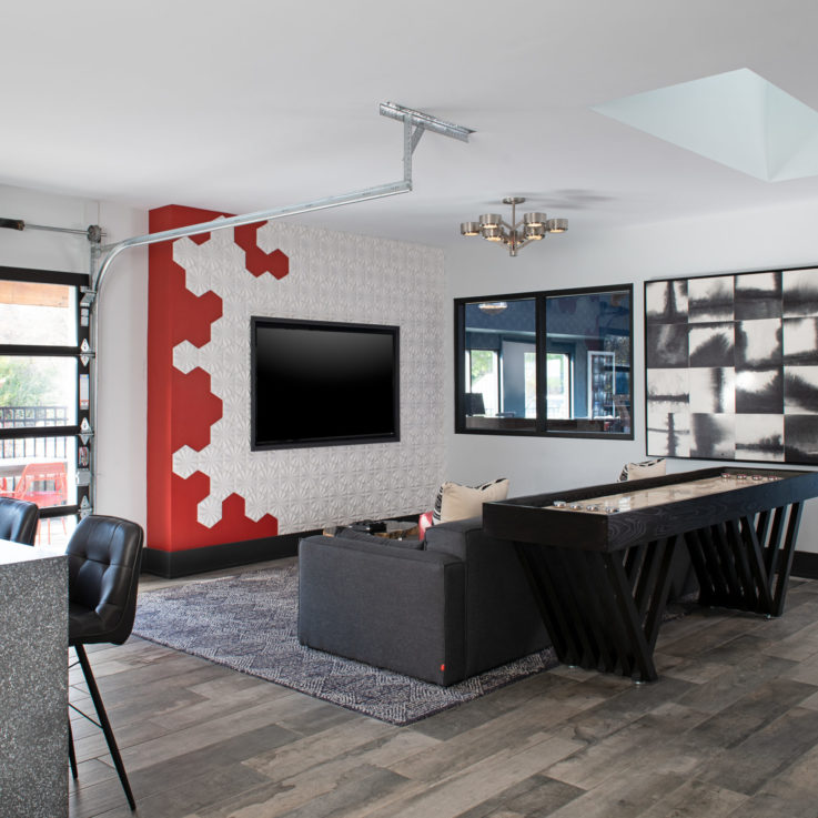 Recreation area with a table shuffleboard and flatscreen television