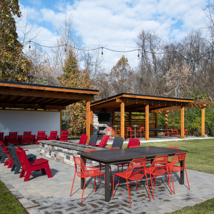 Outdoor seating area with gray and red chairs