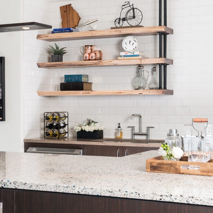 Bar area with white countertops and hanging wooden shelves
