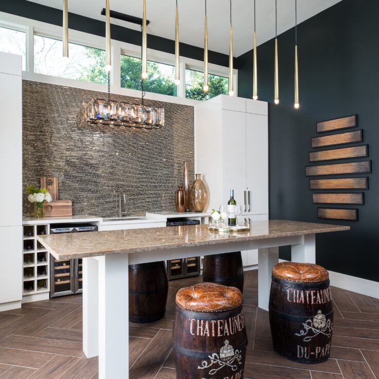 Kitchen area with barrel stools and a beige countertop