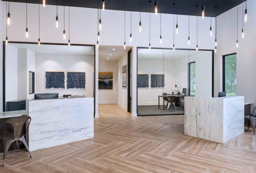 Common area with a wooden floor and marble dividers