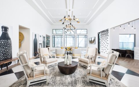 Seating area with leather chairs and a yellow couch