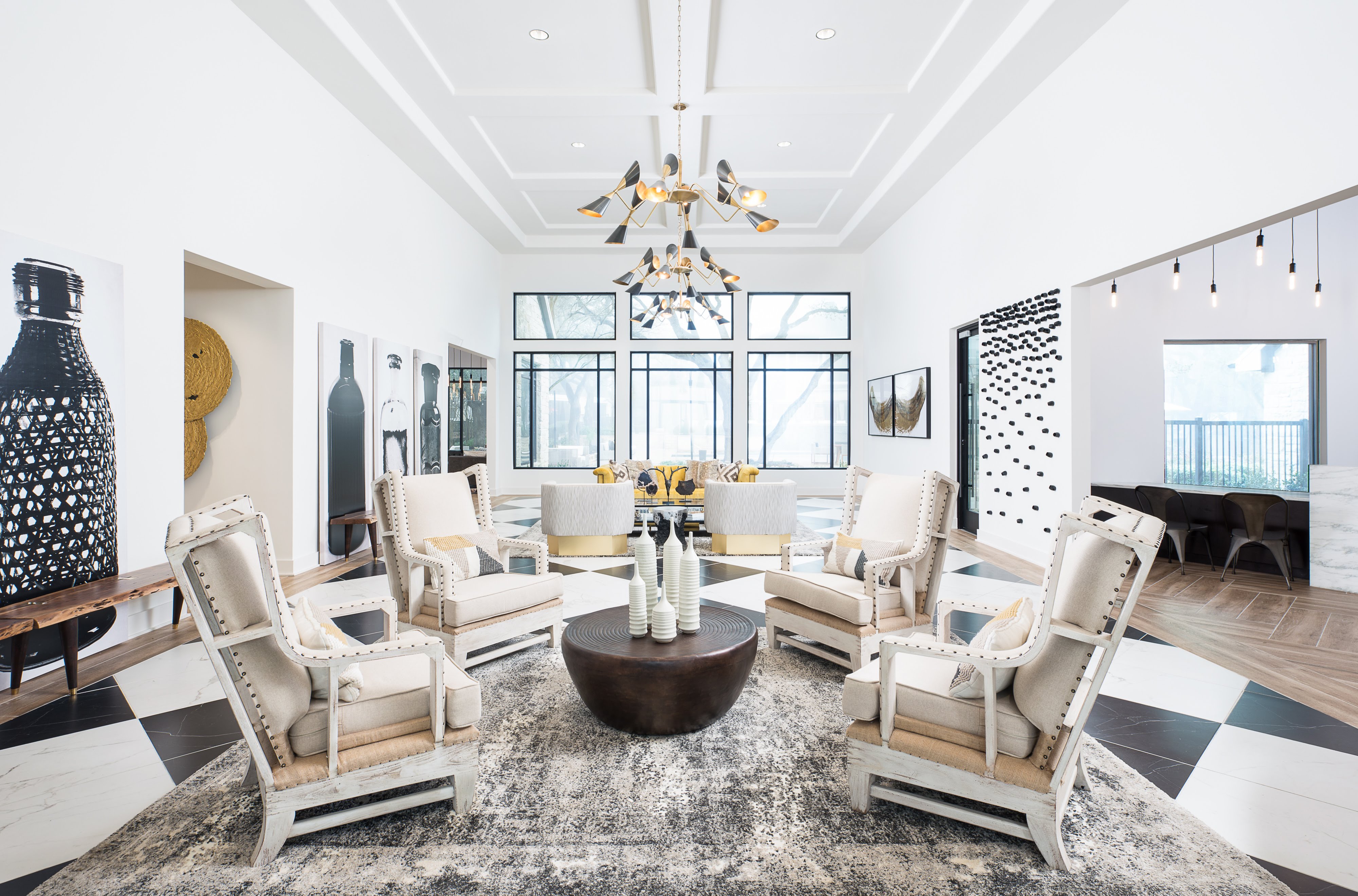 Seating area with leather chairs and a yellow couch