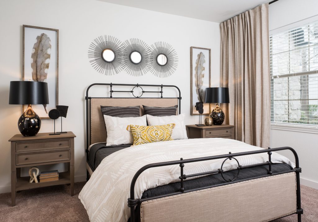 Bed with two nightstands and hanging art