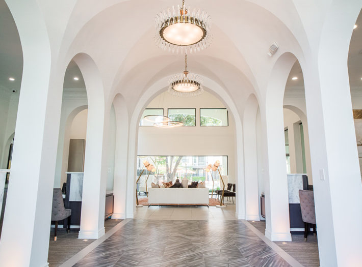 White arches with hanging light fixtures