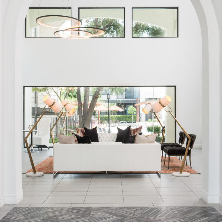 White couches in a living room with tiled floors