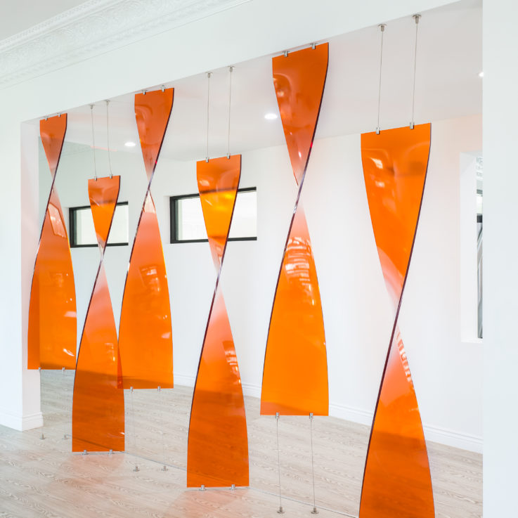 Orange, twisting art fixture
