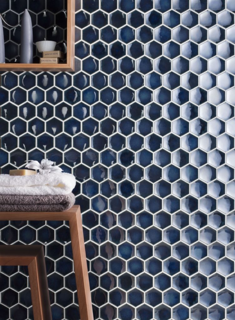 Blue hexagon tiles on a bathroom wall