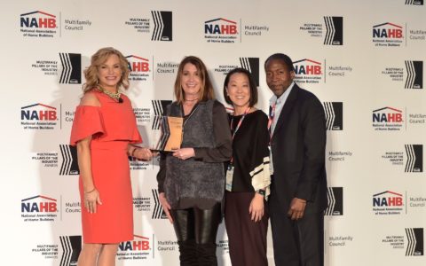 Project designers Jill Barnes, Allison Crosby, and Cliff Joseph accepting an award