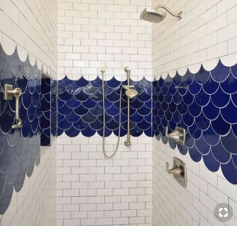 Shower with white bricks and dark blue tiles