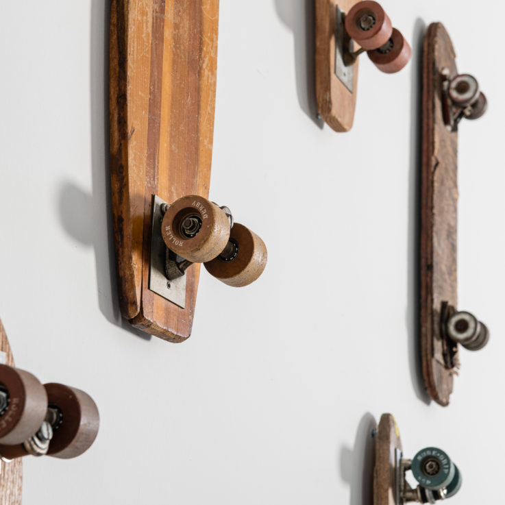 Wooden skateboards hanging on a wall