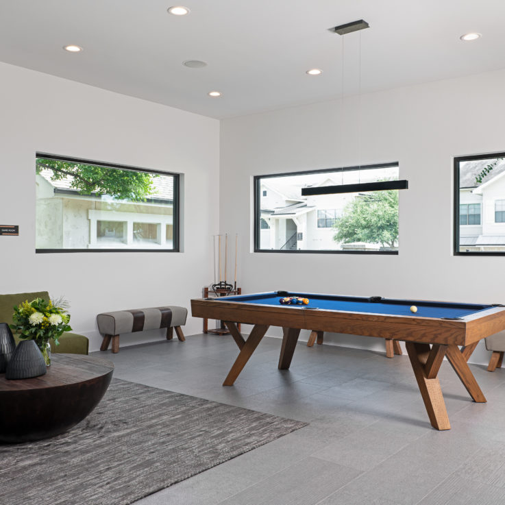Pool table next to a seating area