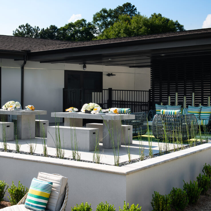 Stone tables and benches outside of the clubhouse