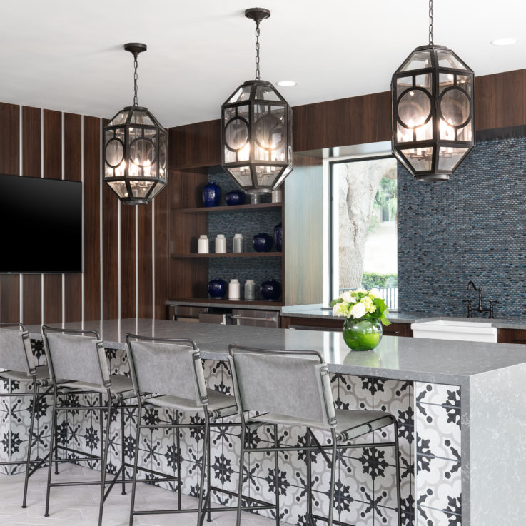 Bar with gray countertop and four gray chairs