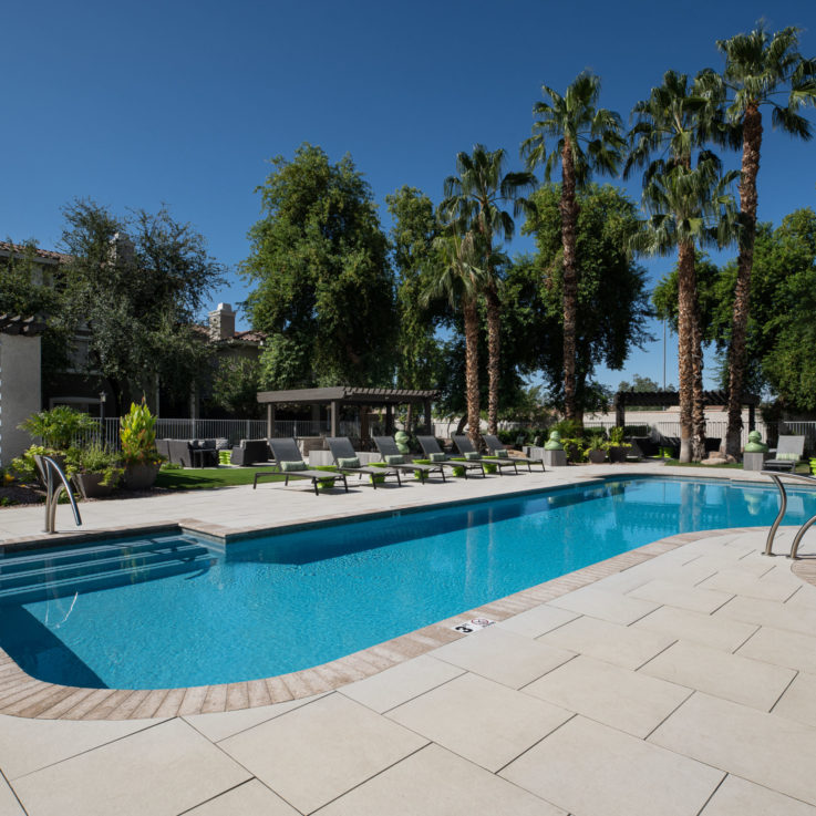 Outdoor pool with beach chairs