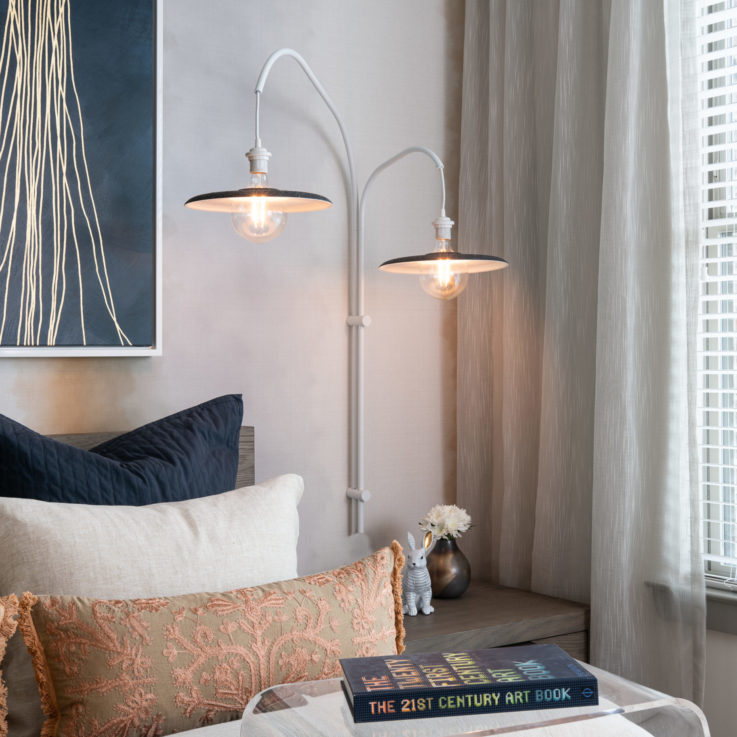 Nightstand with a lamp next to a window