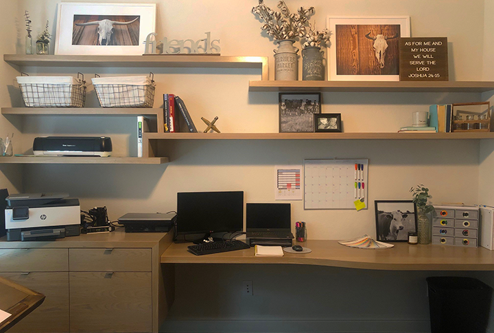 Home office with baskets, computers, shelving