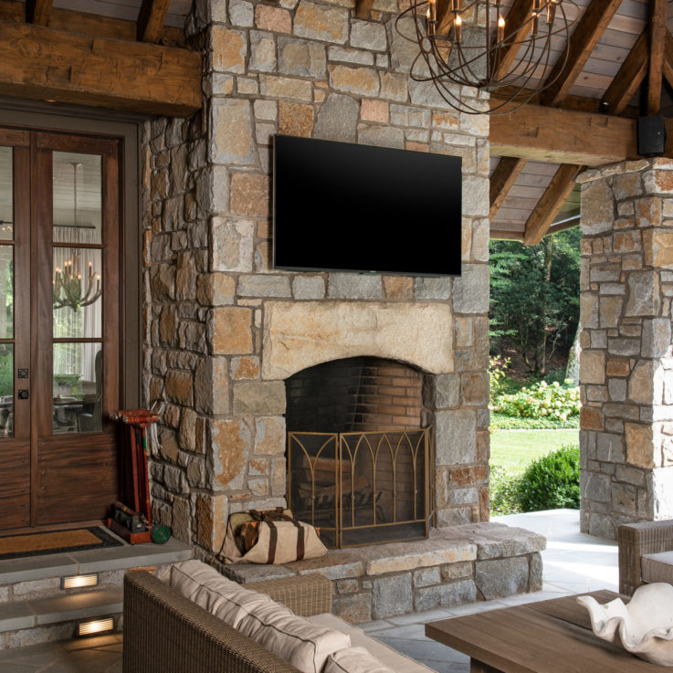 Outside fireplace with TV