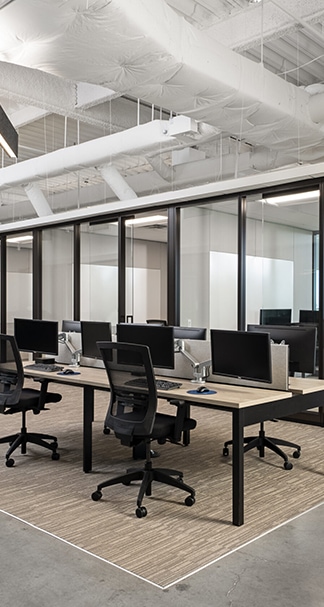 Open office working area with glass walled conference rooms